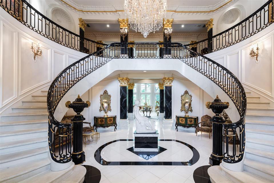 Dramatic foyer with double stairway