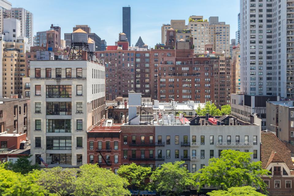 New York City - Overhead view of historic buildings along 59th Street with the Midtown Manhattan skyline in the background