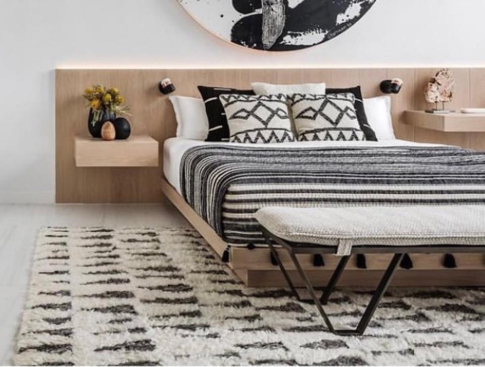 A bed and area rug